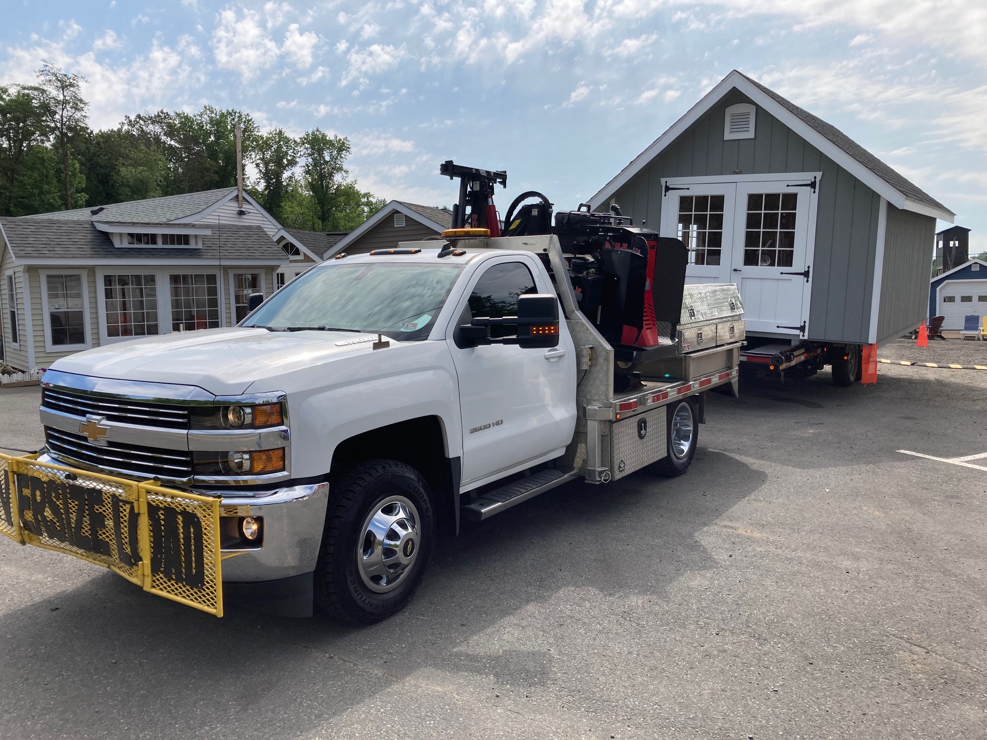 Shed moving truck and trailer with a shed loaded in Virginia